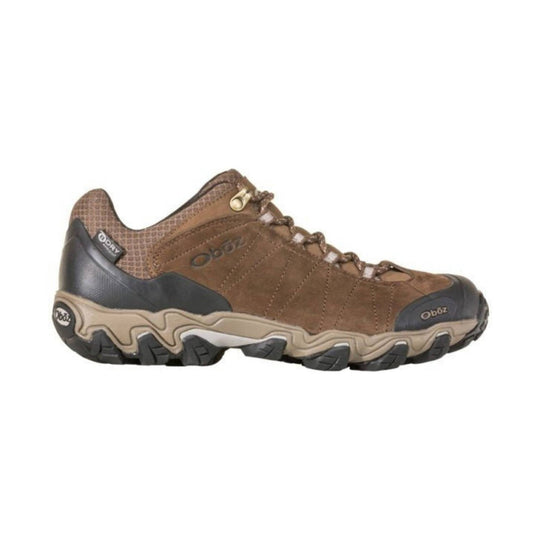 Brown low-cut hiking shoe with black toe and heel caps, lugged sole, and bungee laces
