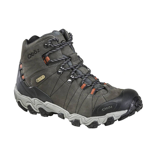 Gray mid-height hiking boot with black rubber toe cap, bungee laces, and rugged tread