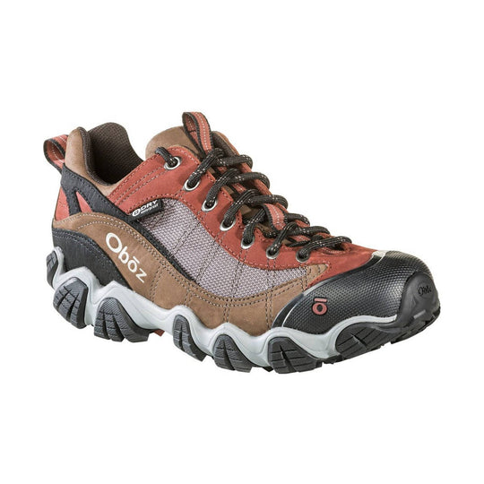Brown and rust low hiking shoe with black toe cap, bungee laces, and rugged tread