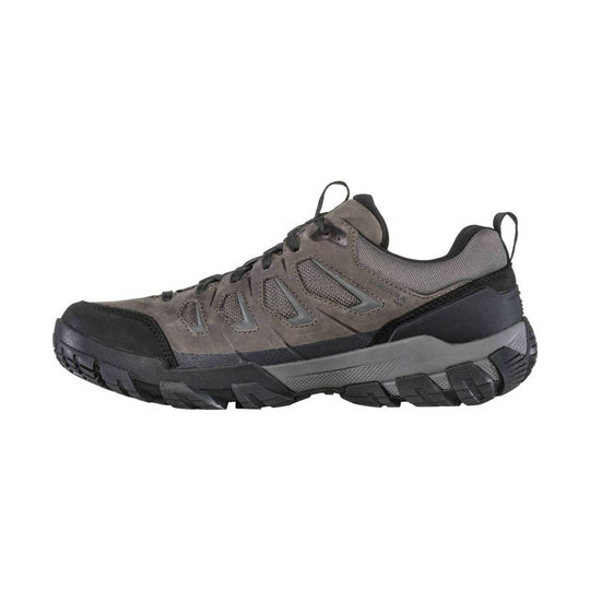 Gray and black low hiking shoe with mesh panels, rubber toe cap, and lugged outsole