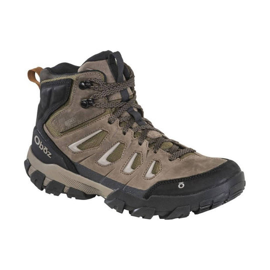 Mid-height hiking boot in tan and black with rugged tread, mesh panels, and visible laces