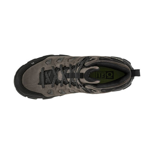 Top-down view of a gray and black mid hiking boot with black laces and rugged sole