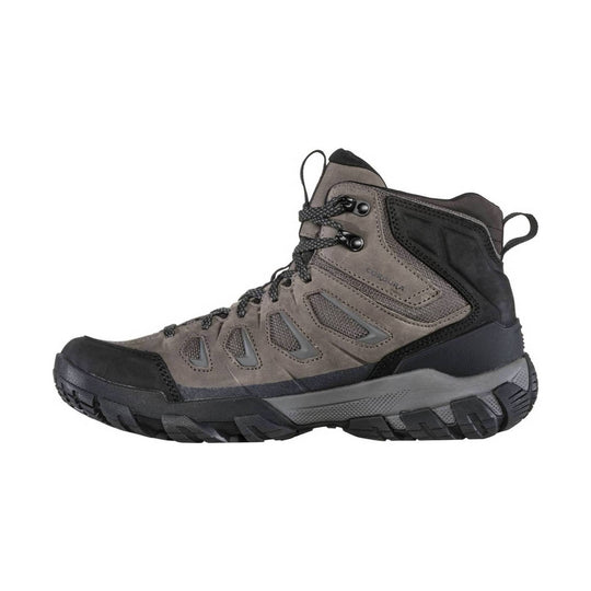Gray and black mid-cut hiking boot with a rugged sole, lace-up closure, and side mesh panels