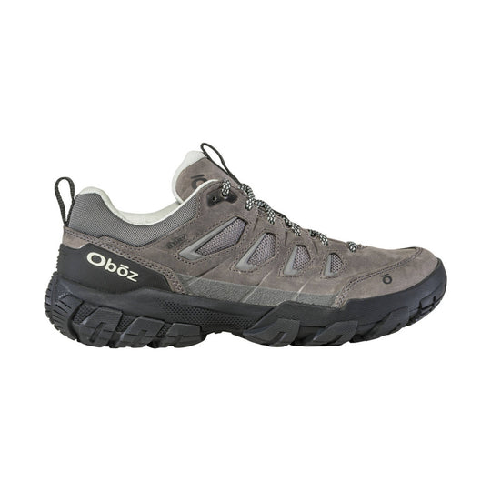 Gray low-top hiking shoe with black tread, mesh panels, and bungee laces