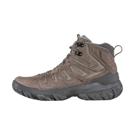 Brown mid-height hiking boot with black outsole, bungee laces, and side cutouts