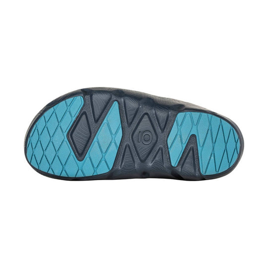 Black shoe outsole with blue traction pods and a visible size 10 marking