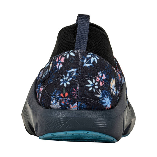 Black slip-on sneaker with floral print heel, pull tab, and teal outsole