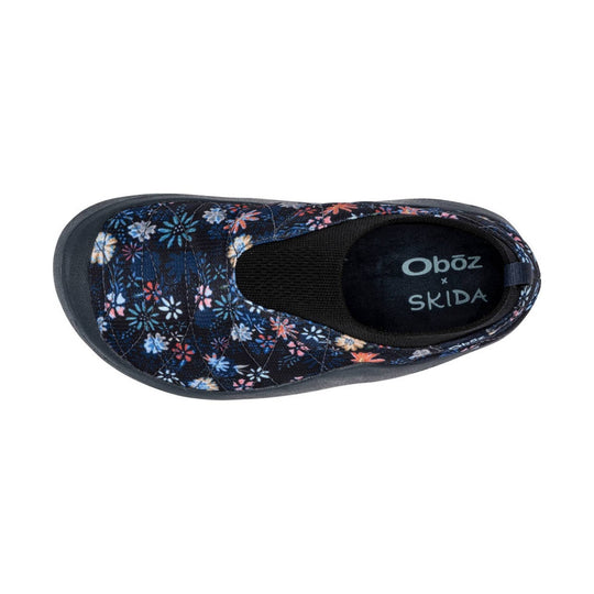Navy floral slip-on shoe with black sole and Oboz x SKIDA branding