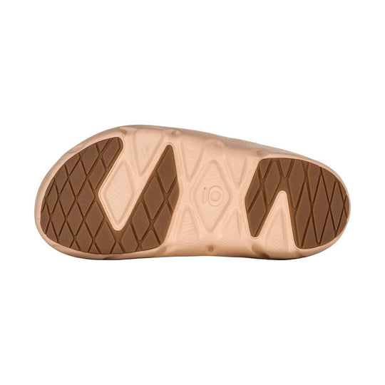 Tan and brown shoe outsole with diamond tread pattern and molded size 10 mark