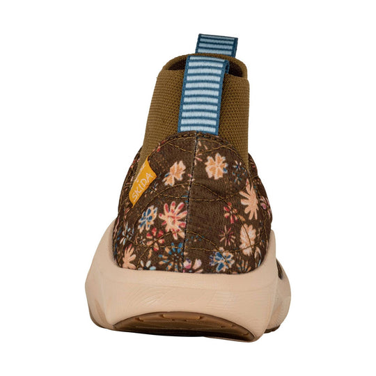 Brown floral slip-on shoe with a blue striped pull tab and cream sole