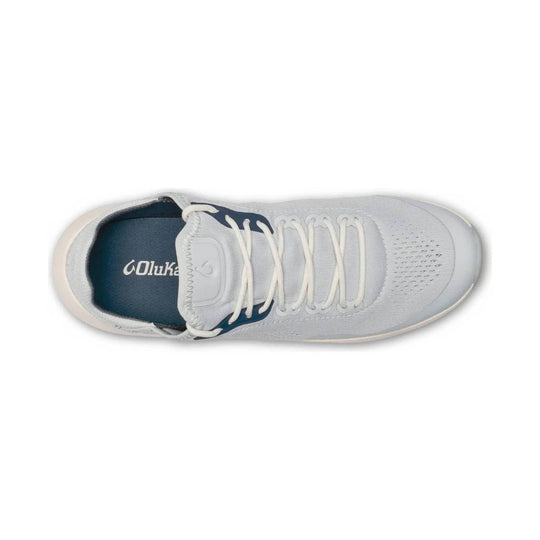 Light gray athletic slip-on shoe with white laces and a dark blue insole, shown from above