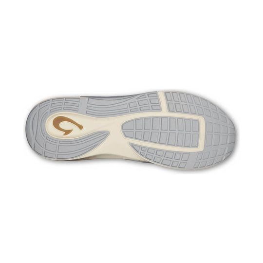 Gray shoe outsole with cream midfoot section and brown logo