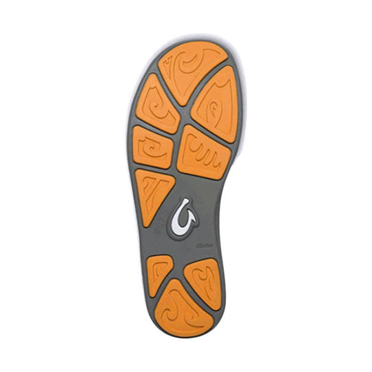 Rubber shoe outsole with orange traction pods and a gray center section