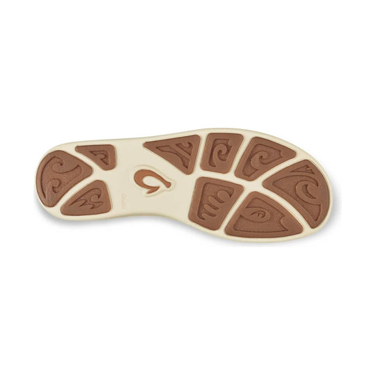 Cream sandal outsole with brown rubber traction pods and wave-shaped tread pattern