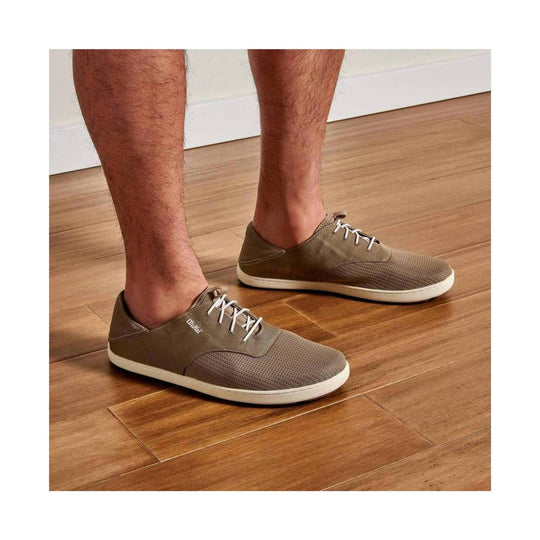 Olive lace-up casual shoes with white soles and mesh uppers