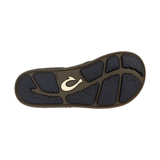 Sandal outsole with black traction pods and a brown midsole