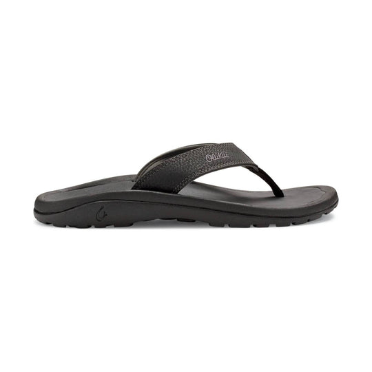 Black thong sandal with textured strap and thick treaded sole, side view