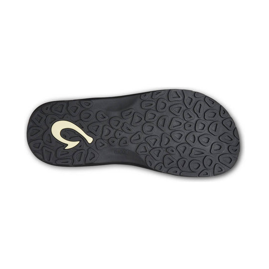 Black sandal outsole with patterned tread and embossed logo