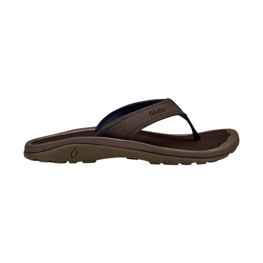 Brown flip flop sandal with textured strap and thick treaded sole