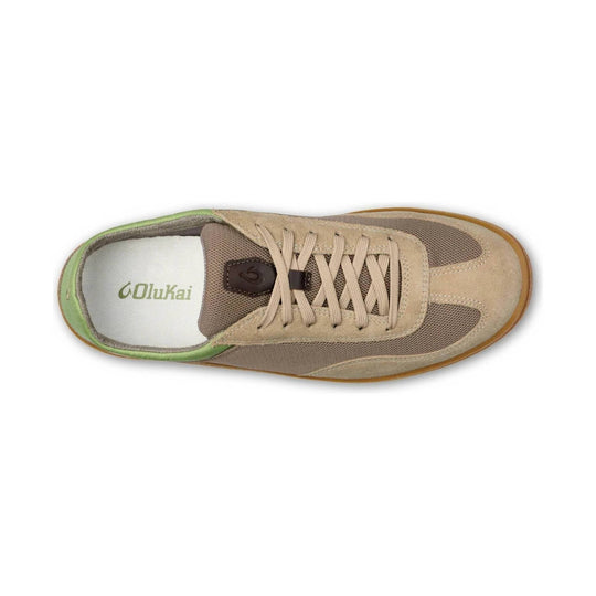 Tan and brown casual sneaker with mesh panels, beige laces, and green trim