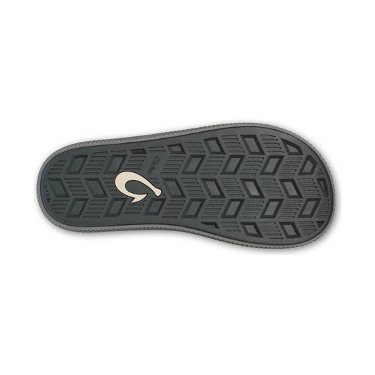 Gray rubber sandal outsole with geometric tread and a large logo in the center