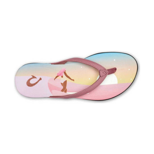 Pink thong flip-flop with a pastel sunset surfboard print and foot silhouette on the insole