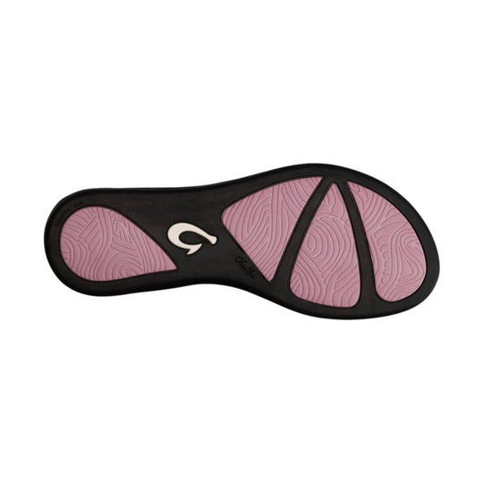 Pink and black sandal outsole with textured rubber tread and a white logo at center