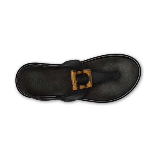 Black leather thong sandal with a tortoiseshell buckle