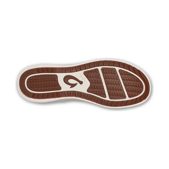 Brown and white boot outsole with treaded rubber sections and OLUKAI branding
