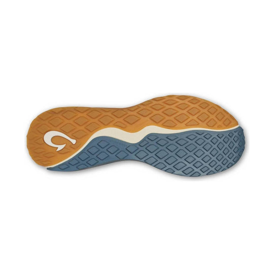 Blue and tan textured shoe outsole with a white wavy midsection and a logo near the heel