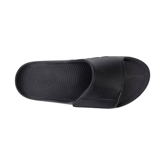 Black slip-on slide sandal with textured footbed and wide top strap