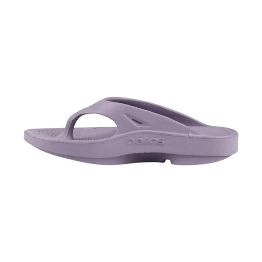 Lavender rubber thong sandal with wide strap and textured footbed, side view