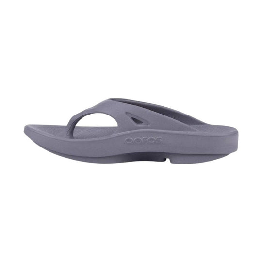 Gray foam flip-flop sandal with a thick sole and toe post, side view