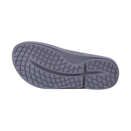 Gray flip-flop sole with textured tread pattern