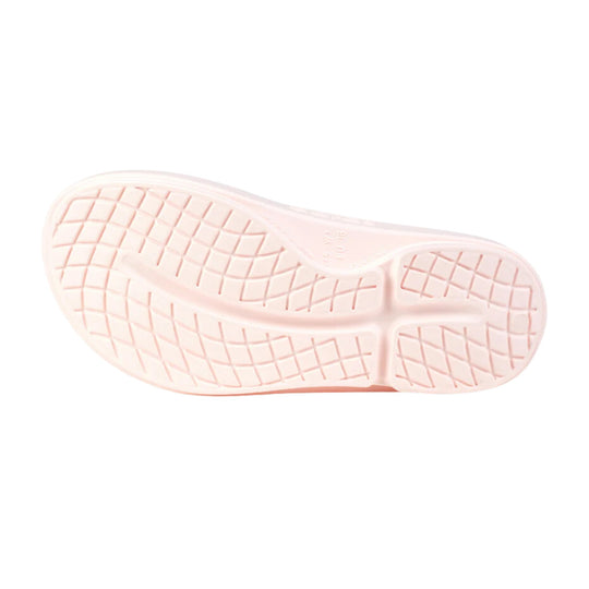 Pale pink flip-flop outsole with grid tread pattern