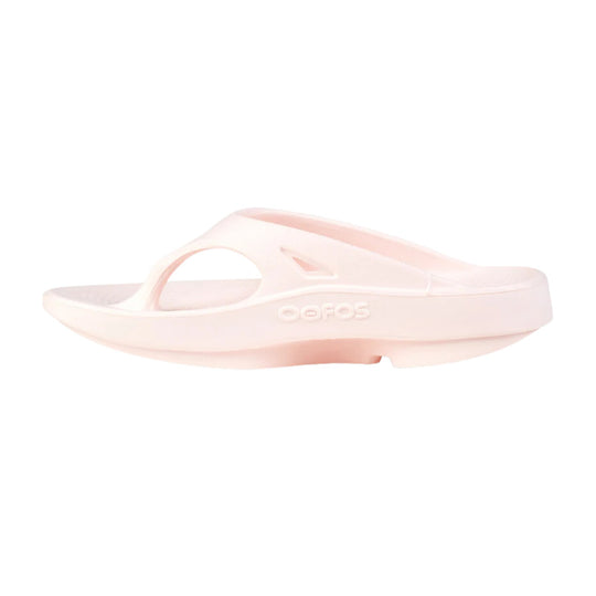 Light pink slide sandal with a thick cushioned sole and embossed OOFOS logo