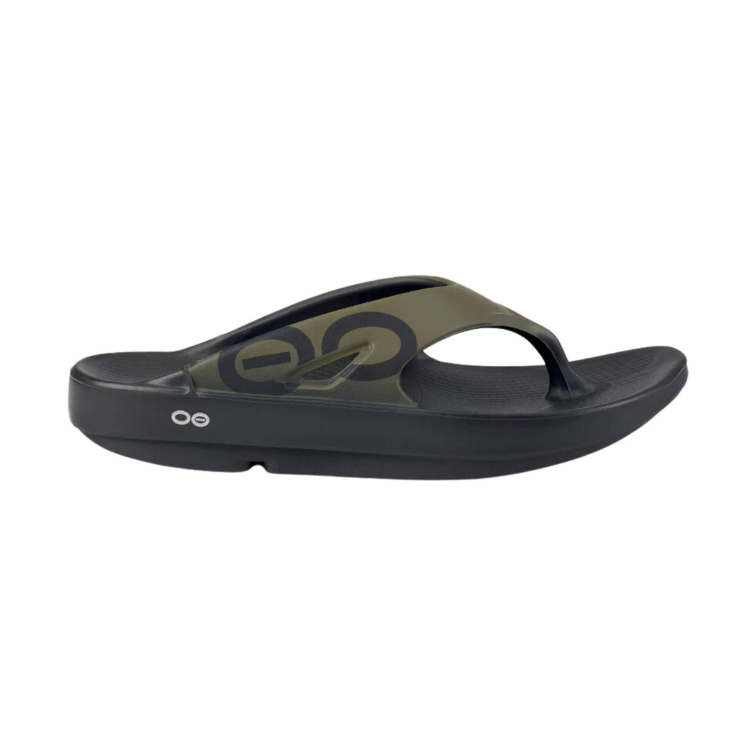 Black and olive thong sandal with a thick cushioned sole and side logo