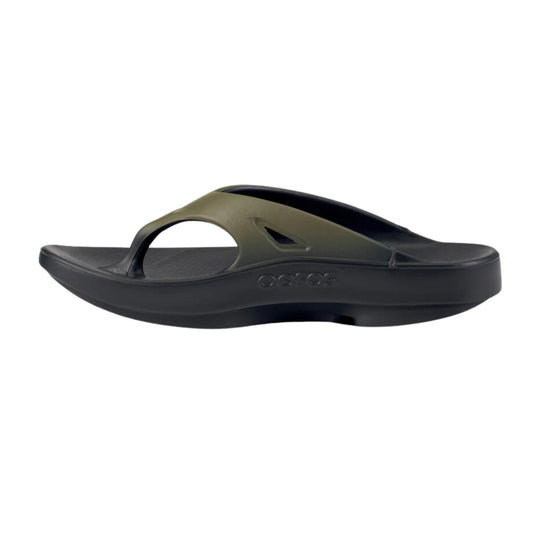 Two-tone slide sandal with a wide strap, open toe, and molded cushioned sole