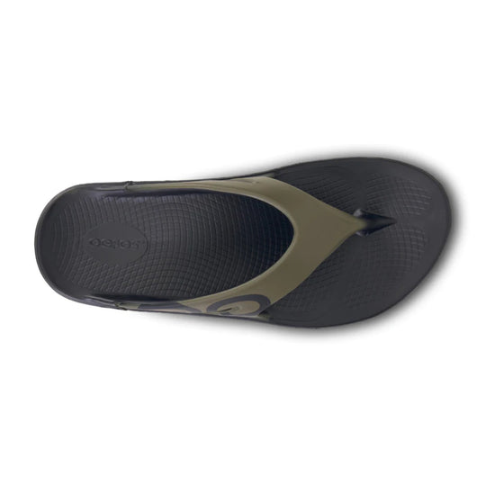 Top view of a black and olive thong sandal with textured footbed