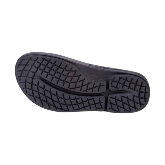 Black slide sandal outsole with grid tread pattern and center grooves