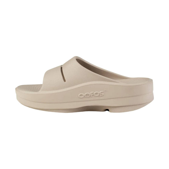 Beige foam platform slide sandal with embossed OOFOS logo