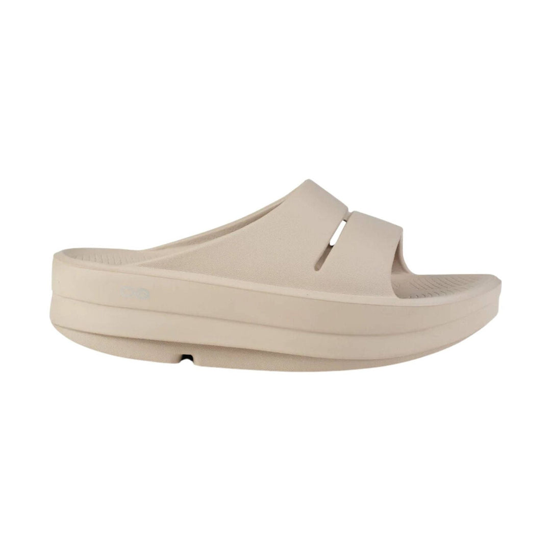 Beige slide sandal with thick platform sole and wide band upper