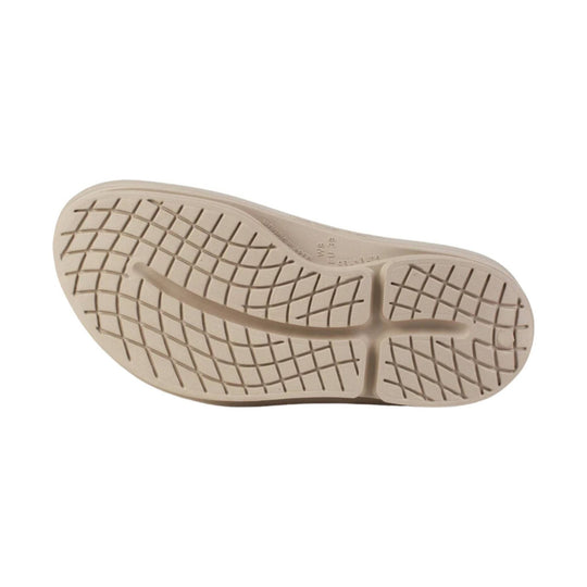 Beige slip-on sandal outsole with grid tread pattern