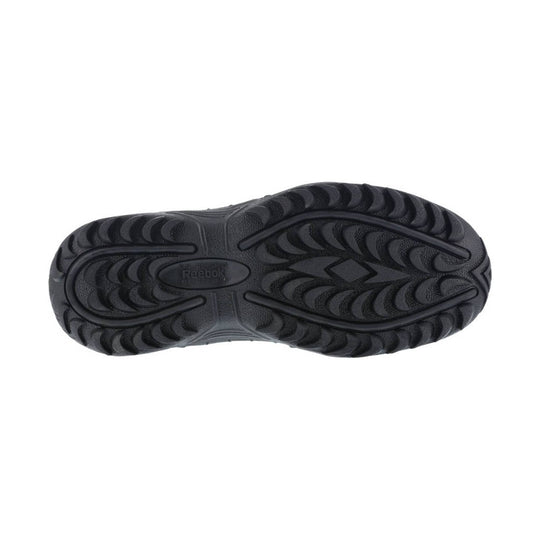 Black rubber boot outsole with deep traction lugs and Reebok branding