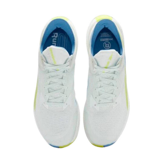 White running shoes with blue insoles, lime accents, and white laces, shown from above