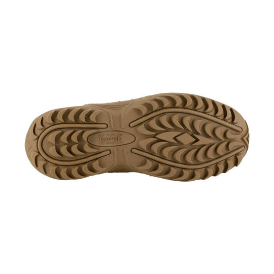 Tan rubber work boot outsole with deep tread and Reebok branding