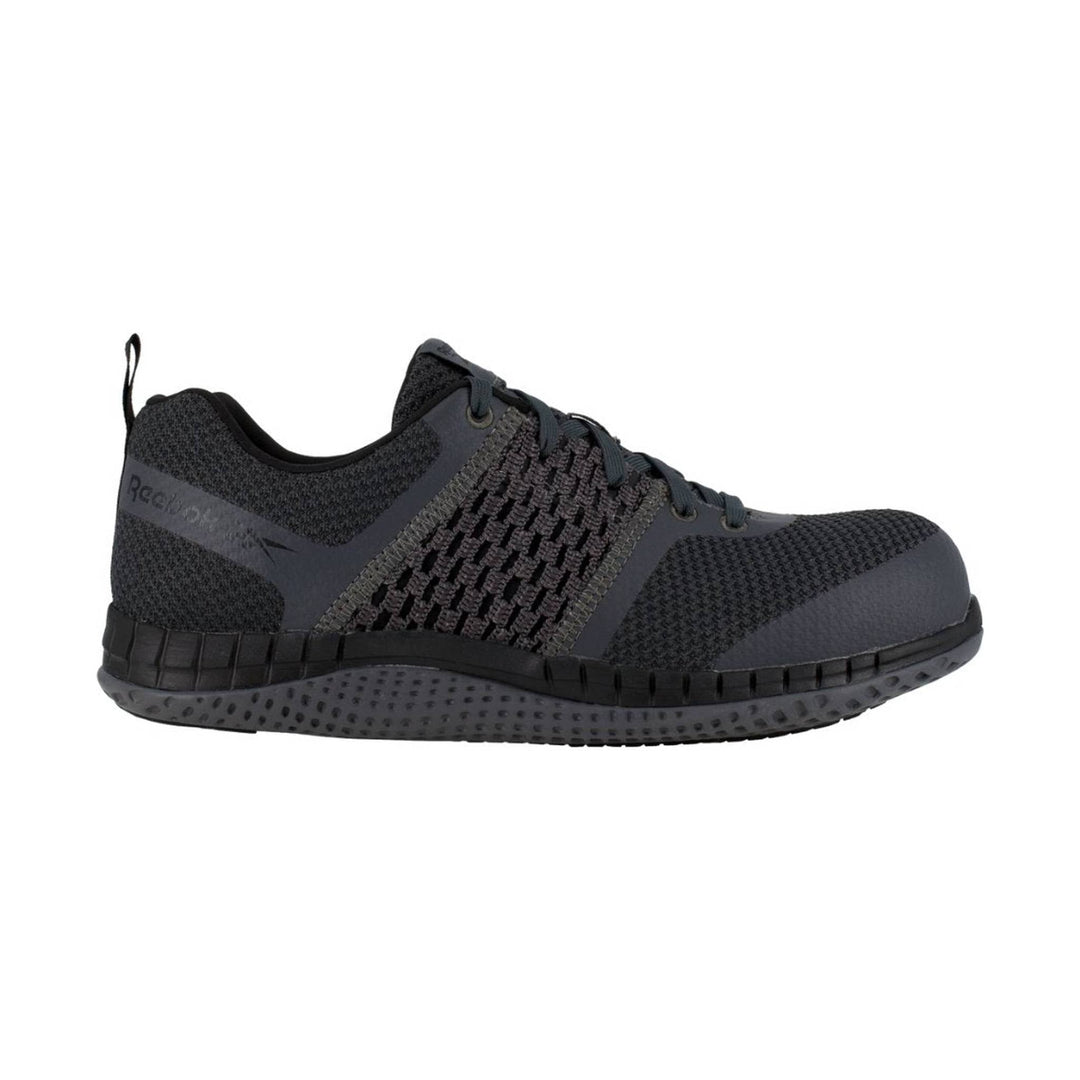 Dark gray and black athletic work shoe with knit upper, laces, and thick sole, shown in side view