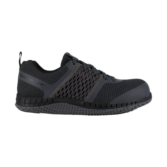 Dark gray and black athletic work shoe with knit upper, laces, and thick sole, shown in side view