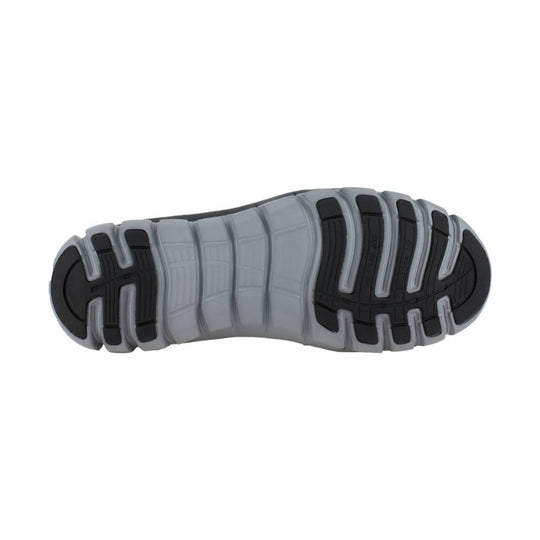 Gray and black lugged shoe outsole with deep flex grooves and tread pods