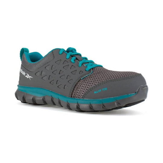 Gray and turquoise athletic work shoe with mesh upper, side cutouts, and teal laces